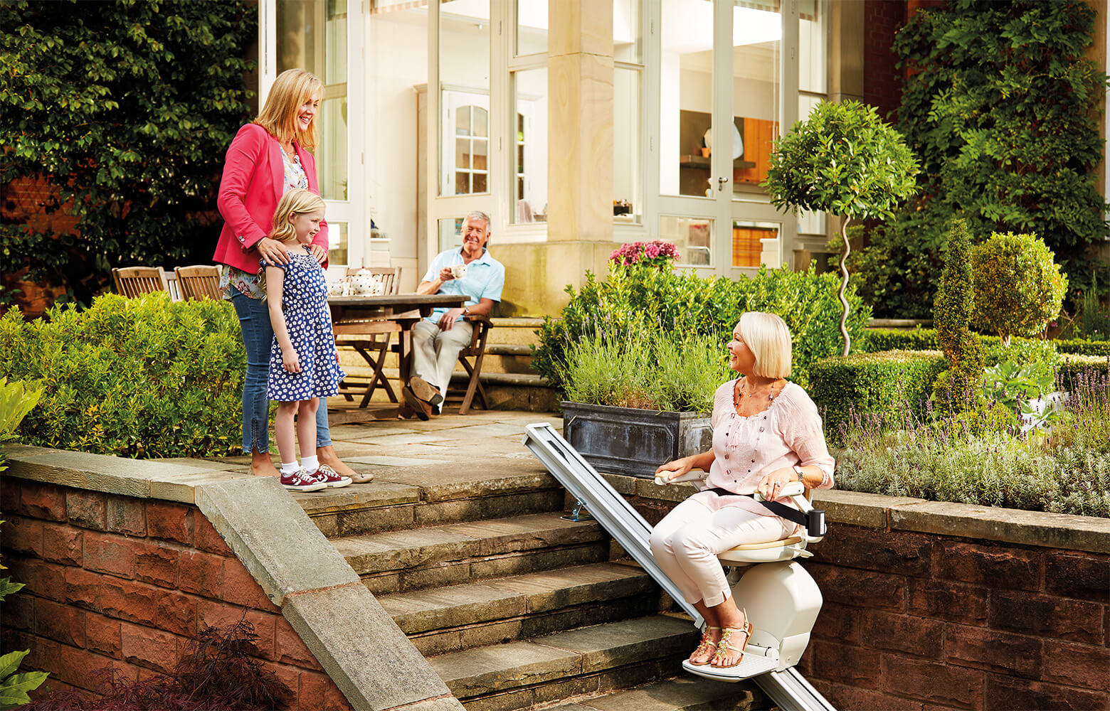 Acorn Stairlift Customer Enjoying an Outdoor Stairlift